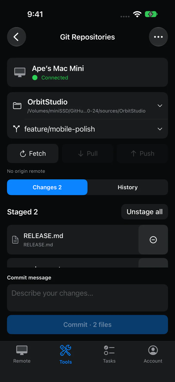 Screenshot: the VibeDesk Git Repositories screen on iPhone, with a connected Mac, a repository and branch, staged files, and a commit message field.